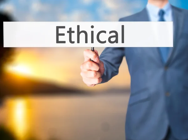 Ethical - zakenman hand hebt van teken — Stockfoto