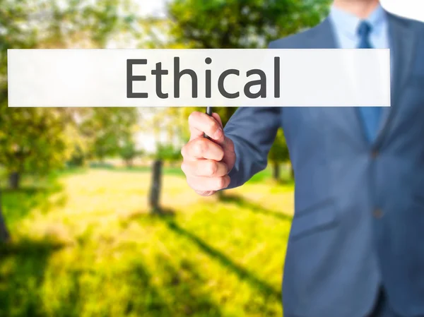 Ethical - zakenman hand hebt van teken — Stockfoto