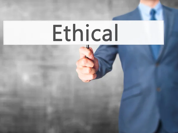 Ethical - zakenman hand hebt van teken — Stockfoto