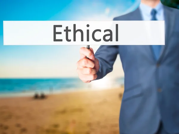 Ethical - zakenman hand hebt van teken — Stockfoto