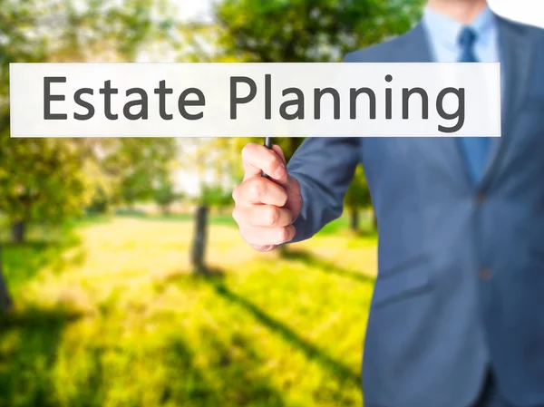 Estate Planning - Businessman hand holding sign — Stock Photo, Image