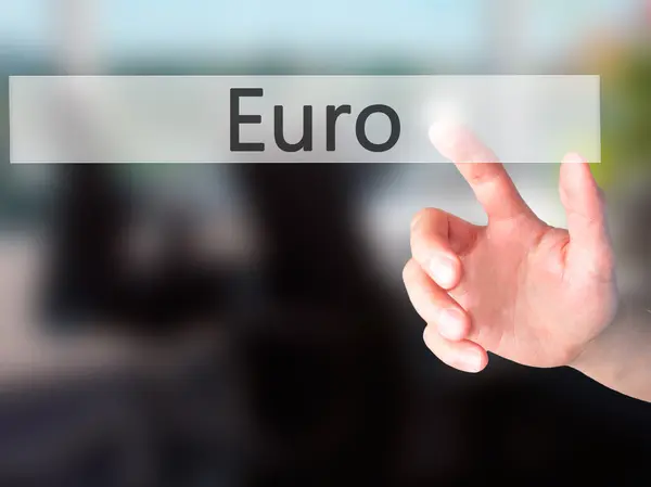 Euro - Hand pressing a button on blurred background concept on v — Stock Photo, Image