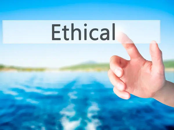 Ethical - Mano premendo un pulsante sul concetto di sfondo sfocato o — Foto Stock