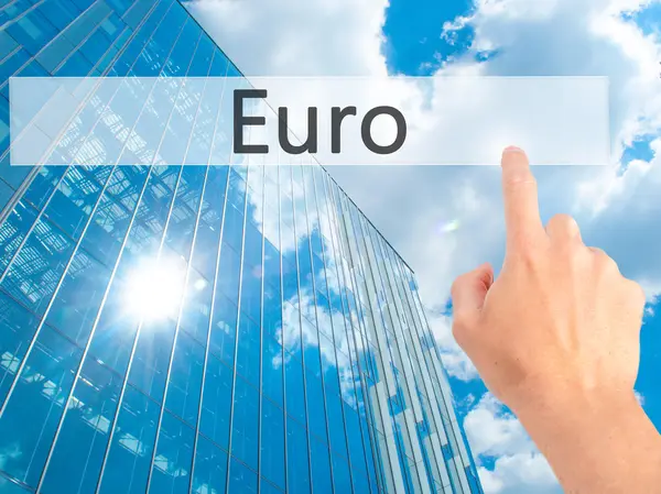 Euro - Hand pressing a button on blurred background concept on v — Stock Photo, Image