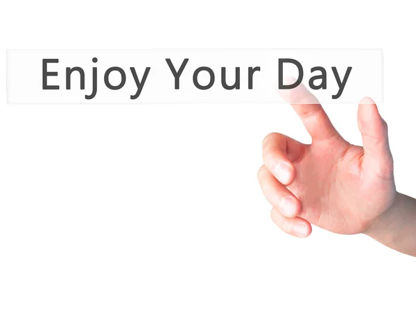 Απολαύστε την μέρα - χέρι πιέζοντας ένα κουμπί στο θολή φόντο co — Φωτογραφία Αρχείου