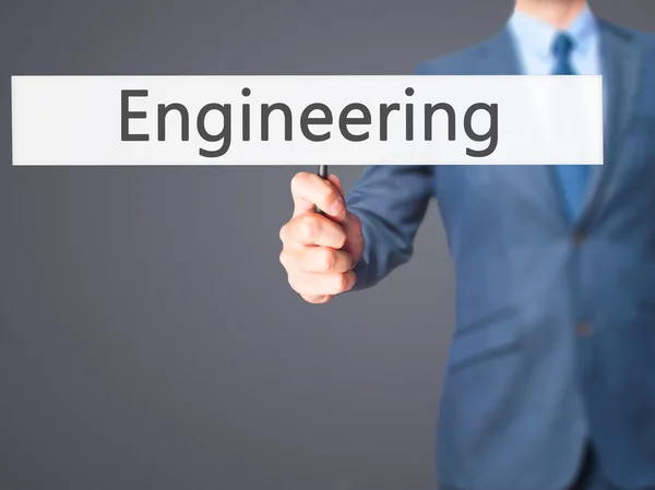 エンジニアリング - ビジネスマンハンドホールディングサイン — ストック写真