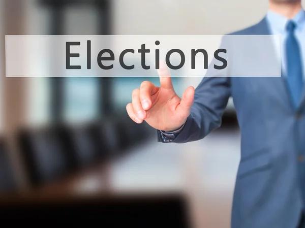 Elections - Businessman hand pressing button on touch screen int — Stock Photo, Image