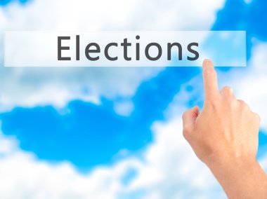 Seçimleri - arka plan bulanık kavramı üzerinde bir düğmeye basarak el