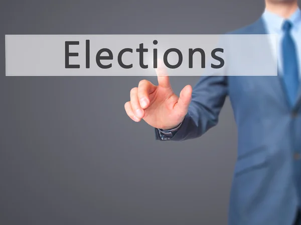 Elections - Businessman hand pressing button on touch screen int — Stock Photo, Image