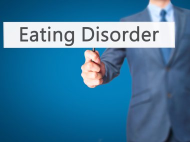 Yeme bozukluğu - işadamı el işareti tutarak