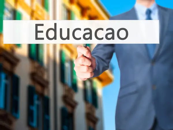 Educaco (Education in Portuguese) - Businessman hand holding sig — Stock Photo, Image