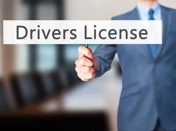 Drivers License - Businessman hand holding sign — Stock Photo, Image