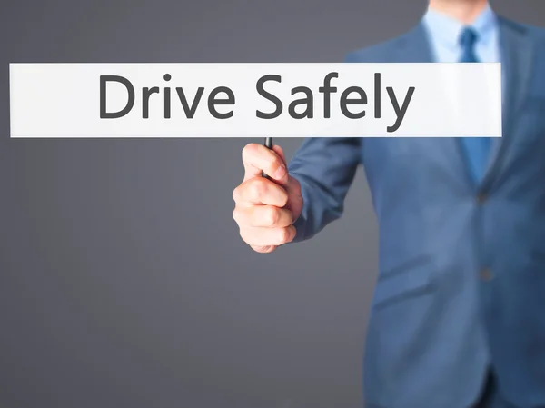 Drive Safely - Businessman hand holding sign — Stock Photo, Image