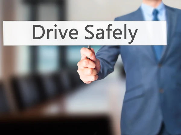 Drive Safely - Businessman hand holding sign — Stock Photo, Image