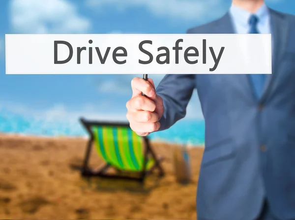 Drive Safely - Businessman hand holding sign — Stock Photo, Image
