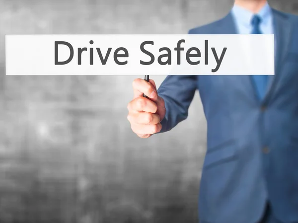 Drive Safely - Businessman hand holding sign — Stock Photo, Image