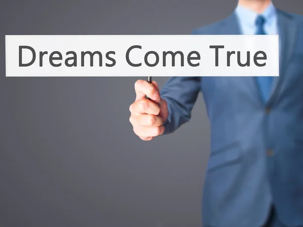 Dreams Come True - affärsman hand med skylt — Stockfoto