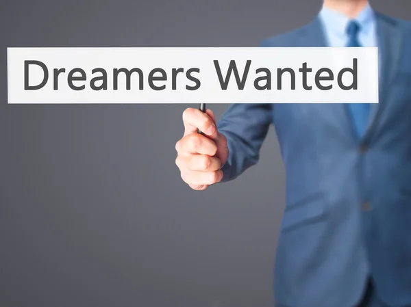 Ονειροπόλοι Wanted - επιχειρηματίας χέρι κρατάει πινακίδα — Φωτογραφία Αρχείου