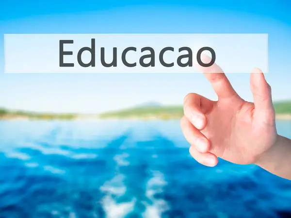 Educaco (Education in Portuguese) - Hand pressing a button on bl — Stock Photo, Image