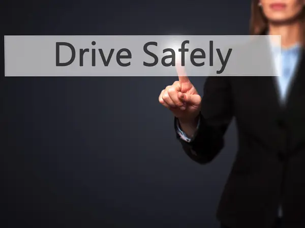 Drive Safely  - Businesswoman hand pressing button on touch scre — Stock Photo, Image