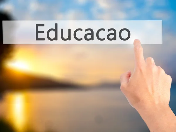 Educaco (Education in Portuguese) - Hand pressing a button on bl — Stock Photo, Image