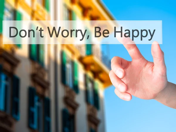 Don't Worry, Be Happy - Hand pressing a button on blurred backgr — Stock Photo, Image