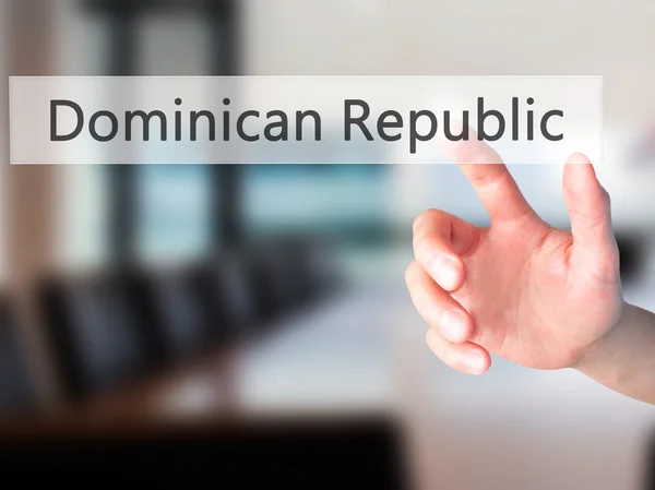 多米尼加共和国-手上模糊背景按钮 — 图库照片