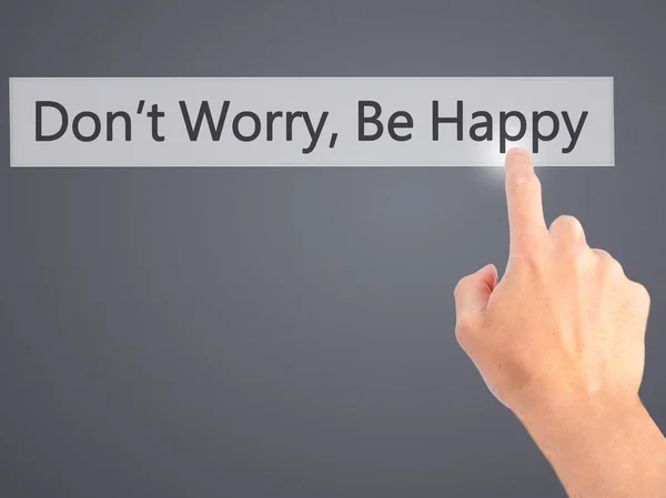 Don't Worry, Be Happy - Hand pressing a button on blurred backgr — Stock Photo, Image