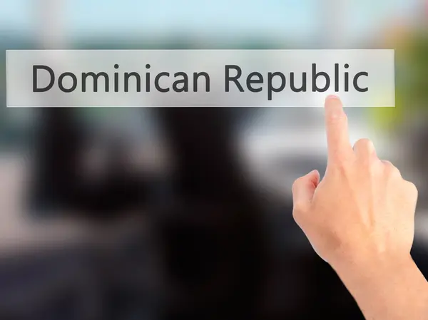 ドミニカ共和国 - ぼやけて背景がある、ボタンを押すと手 — ストック写真