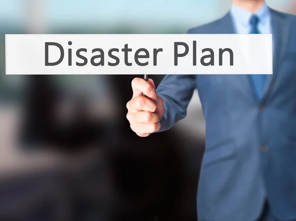 Disaster Plan - Businessman hand holding sign — Stock Photo, Image