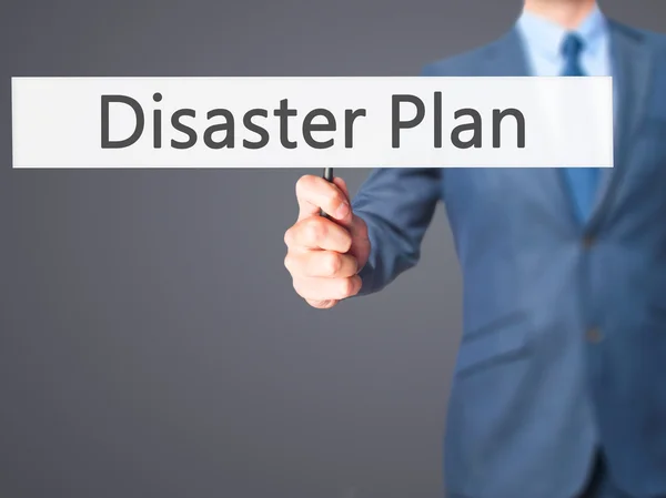Disaster Plan - Businessman hand holding sign — Stock Photo, Image