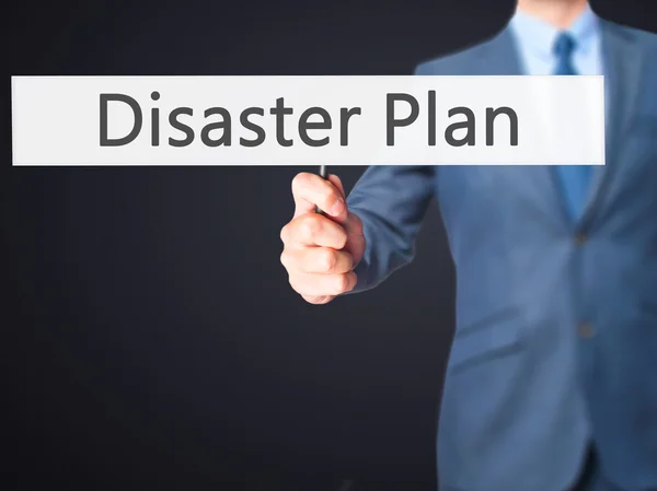 Disaster Plan - Businessman hand holding sign — Stock Photo, Image