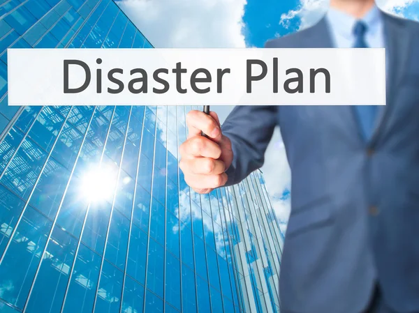 Katastrof Plan - affärsman hand med skylt — Stockfoto