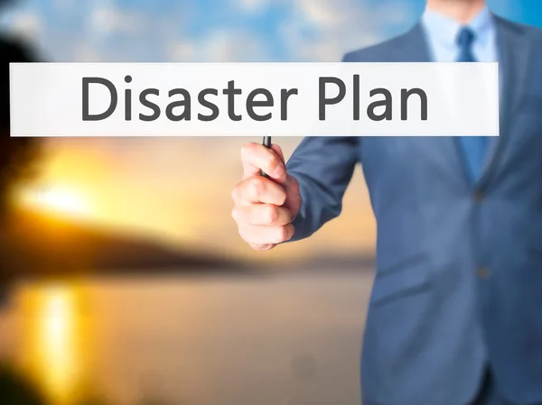 Disaster Plan - Businessman hand holding sign — Stock Photo, Image