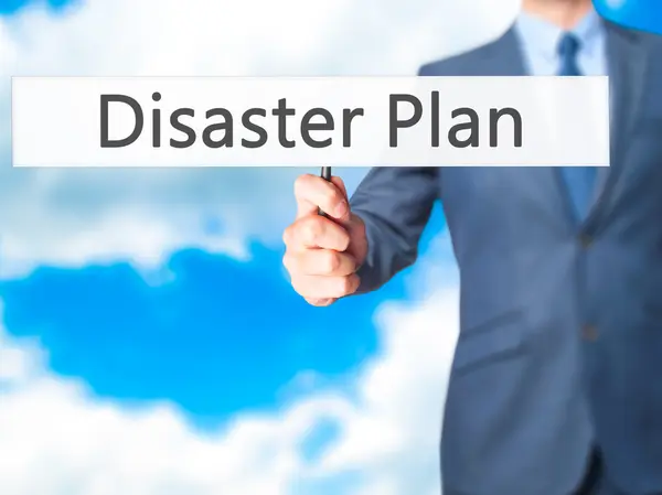 Disaster Plan - Businessman hand holding sign — Stock Photo, Image