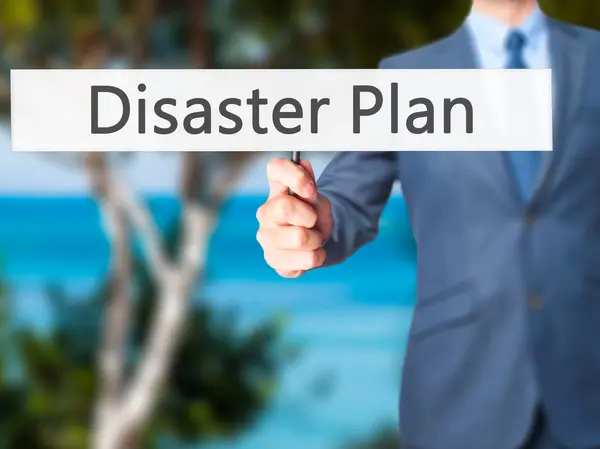 Disaster Plan - Businessman hand holding sign — Stock Photo, Image