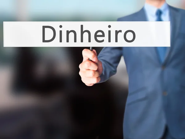 Dinheiro (pengar på portugisiska)-affärsman hand Holding Sign — Stockfoto