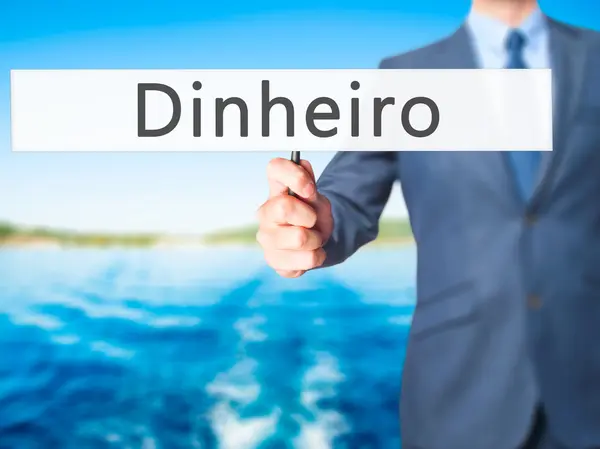 Dinheiro (pengar på portugisiska)-affärsman hand Holding Sign — Stockfoto