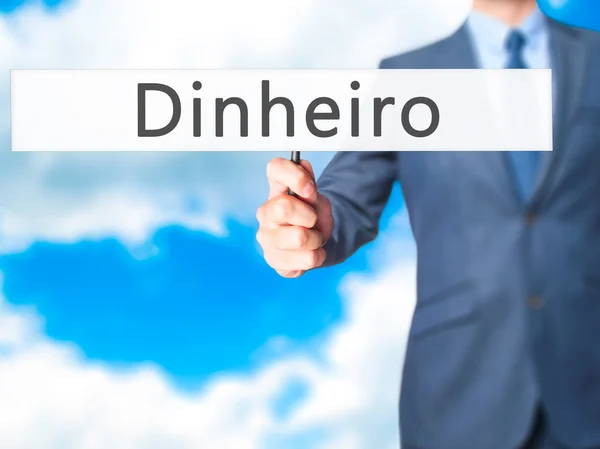 Dinheiro (Деньги на португальском языке) - Бизнесмен ручной холдинг знак — стоковое фото