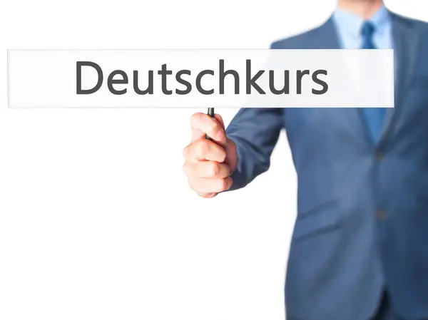 Deutschkurs (niemiecki kurs w języku niemieckim)-biznesmen Holding ręczny — Zdjęcie stockowe