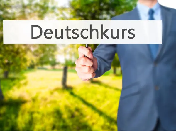 Deutschkurs (tysken jagar i tysk)-affärsmannen räcker innehav — Stockfoto