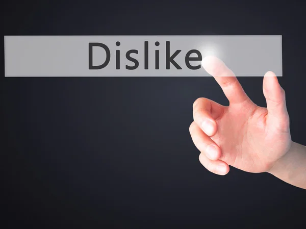 Dislike - Hand pressing a button on blurred background concept o — Stock Photo, Image