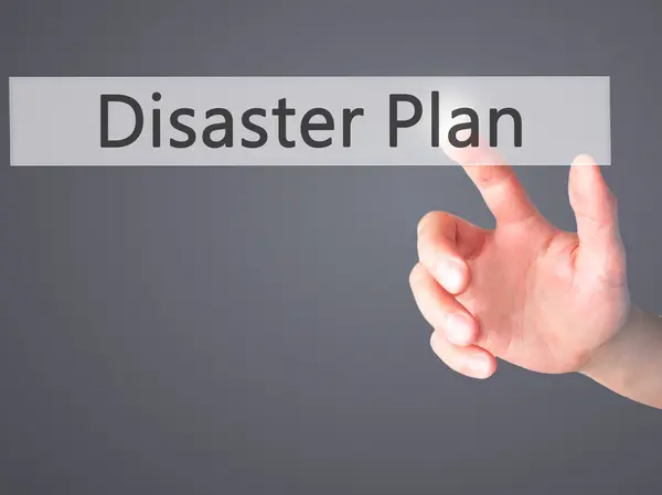 Disaster Plan - Hand pressing a button on blurred background con — Stock Photo, Image