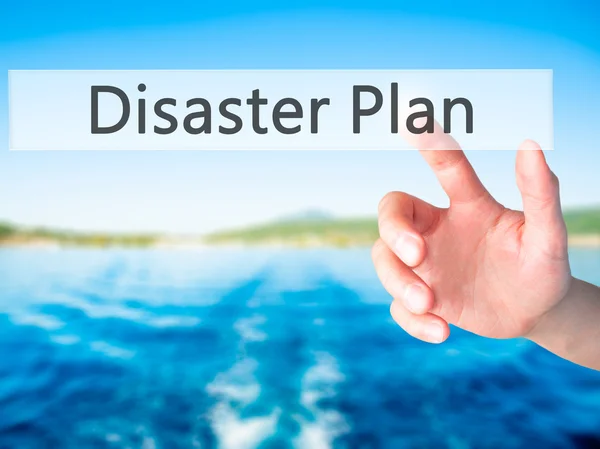 Disaster Plan - Hand pressing a button on blurred background con — Stock Photo, Image