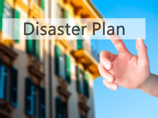 Disaster Plan - Hand pressing a button on blurred background con — Stock Photo, Image