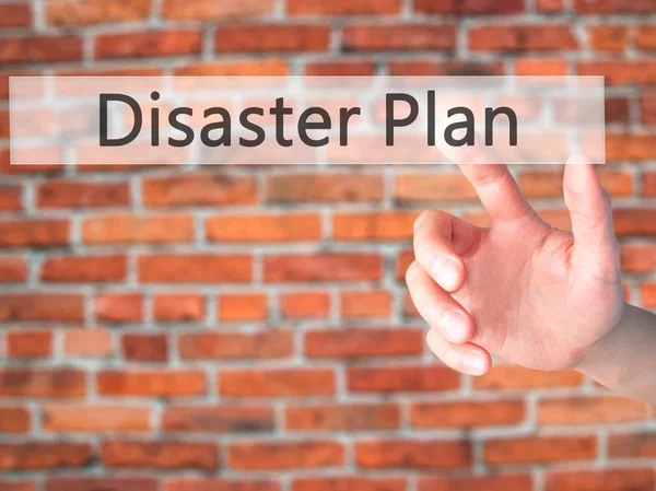 Disaster Plan - Hand pressing a button on blurred background con — Stock Photo, Image