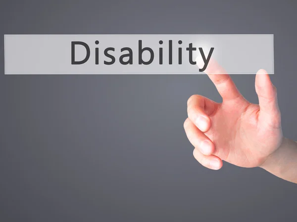 Disabilità - Mano premendo un pulsante su sfondo sfocato concep — Foto Stock