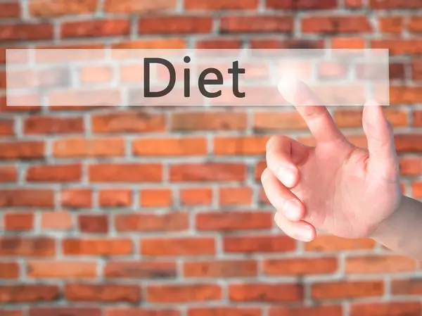 Diet - Hand pressing a button on blurred background concept on v — Stock Photo, Image