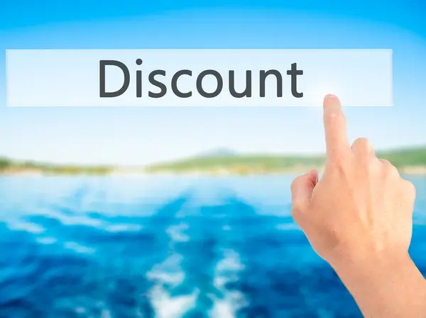 Discount - Hand pressing a button on blurred background concept — Stock Photo, Image
