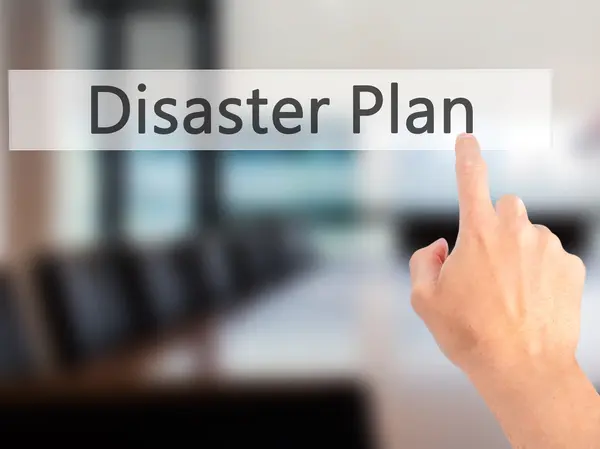 Disaster Plan - Hand pressing a button on blurred background con — Stock Photo, Image